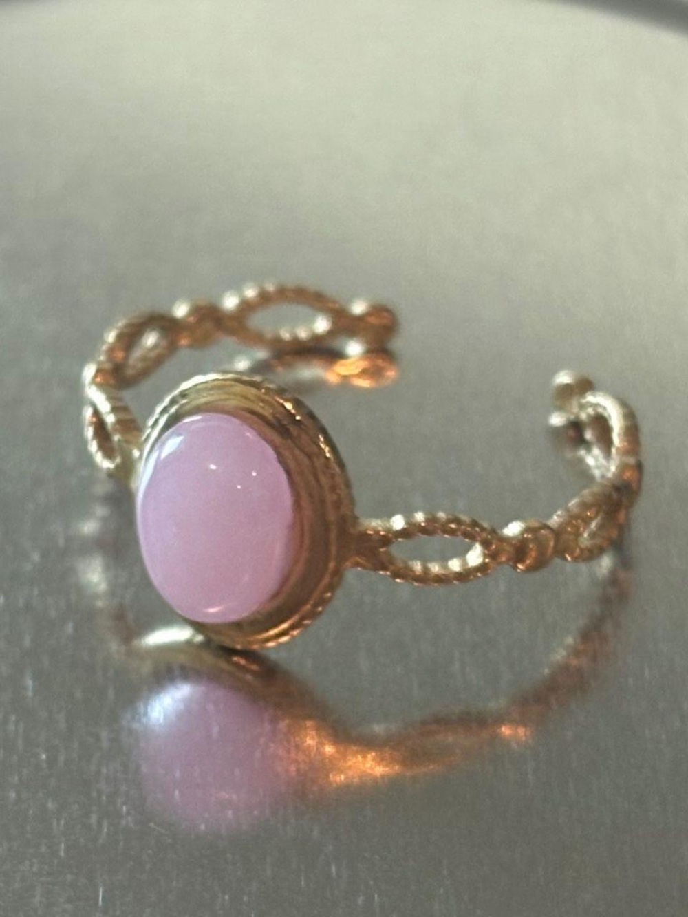 Gold-Tone Ring with Pink Cabochon and Twisted Band